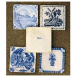 Four Delft blue and white tiles and a transfer printed tile