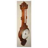 Early 20th Century carved oak-cased aneroid barometer with thermometer, Winter & Son, Newcastle,