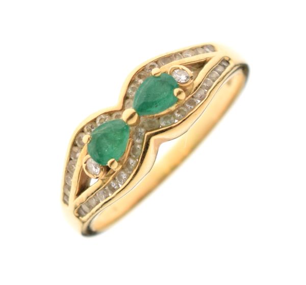 18ct gold, emerald and diamond chip dress ring set two central emeralds within a diamond border,
