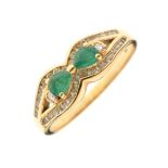 18ct gold, emerald and diamond chip dress ring set two central emeralds within a diamond border,