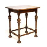 Early 20th Century oak rectangular top side table raised on turned supports, 70.5cm wide