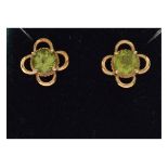 Pair of unmarked yellow metal and peridot-set ear studs, 2.1g gross approx