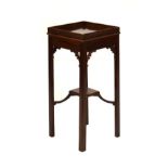 Mahogany urn stand having blind fret work gallery, raised on square chamfered supports united by X
