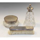 George VI glass dressing jar with silver lid, 2.1toz approx, a silver backed brush and a glass