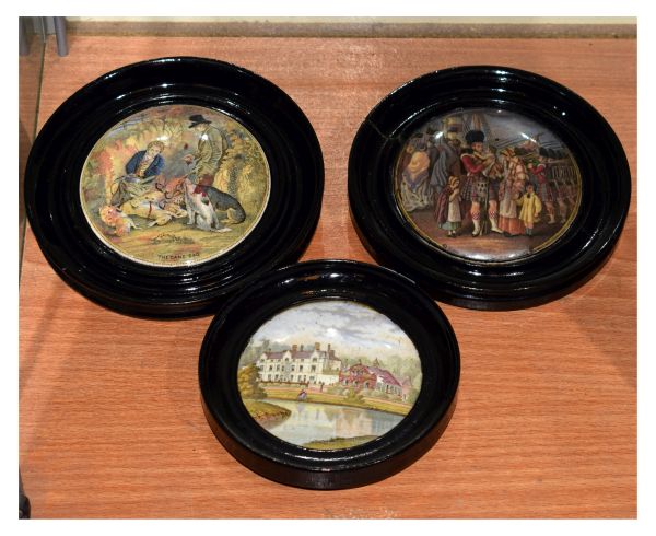 Three pots lids, The Game Bag, Embarking For The East and one other, all within ebonised frames