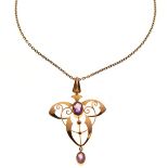 Early 20th Century Art Nouveau yellow metal and amethyst pendant of whiplash design set two purple