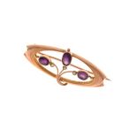 Murrle Bennett - Arts & Crafts yellow metal and amethyst bar brooch of oval design set three