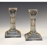 Pair of early 20th Century Walker & Hall Sheffield silver-plated Corinthian column candlesticks of