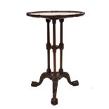 Reproduction mahogany occasional table having pie-crust edge, triple column supports and tripod