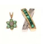 Yellow metal, emerald and diamond scarf pendant of X or crossover design set seven square emeralds