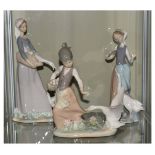 Three Lladro porcelain figure groups all with geese, the tallest standing 27cm high