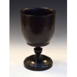 Large 19th Century treen (probably Lignum Vitae) pedestal cup, with rounded bowl on caster-turned