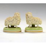 Pair of Dresden porcelain grog decorated sheep on circular plinth with Dresden mark below, 55cm high