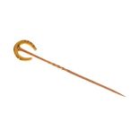 Yellow metal horseshoe stickpin stamped 18ct, in box of Reid & Sons, Newcastle-on-Tyne