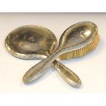 Two piece silver-plated dressing set containing a mirror and brush