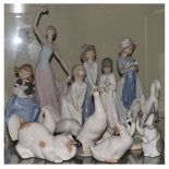 Lladro figure of a young girl in nightdress, together with a large collection of Nao figures etc