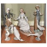 Five Lladro figures and one Nao goose, the tallest standing 24cm high