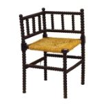 Early 20th Century ebonised ball turned corner chair having seagrass seat