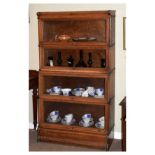 Globe Wernicke type four section oak bookcase fitted up-and-over glazed doors, 86cm wide