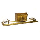 Late Victorian/Edwardian brass fender with urn finials and scroll side ornaments, 132cm wide,