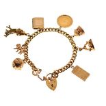 18ct gold curb-link charm bracelet set eight various charms to include; a half sovereign 1912 and