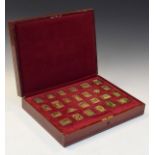 The Empire Collection, a set of twenty five silver ingots in the form of British Empire stamps, in a