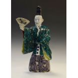 Oriental porcelain figure of an actor holding fan, 43cm high