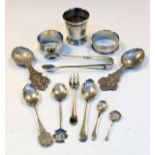 Various silver items to include; a pair of white metal caddy spoons, Elizabeth II silver cup, London