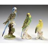 Royal Worcester budgerigar having puce backstamp, 17cm high, together with an Austrian figure of a