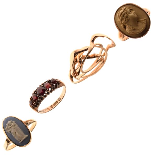 Seven assorted 9ct gold and yellow metal rings to include; lava stone cameo ring, Wedgwood-style
