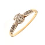 Yellow metal and diamond ring, set central Old European-cut stone between smaller chips to