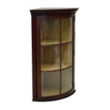 Early 20th Century mahogany bowfront wall hanging corner display cabinet fitted two shelves, 102cm
