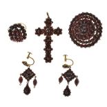 Collection of Bohemian garnet jewellery, comprising: a cross pendant; a cluster brooch; a cluster