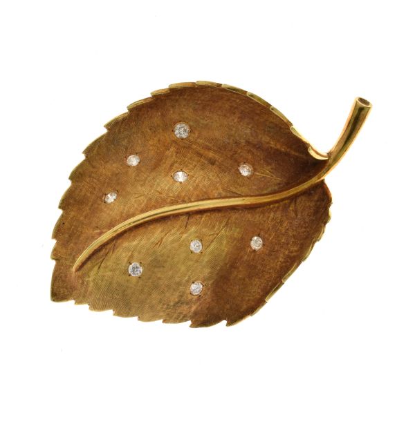 Diamond set leaf brooch, tagged '18k Italy', randomly set with nine brilliant cuts totalling