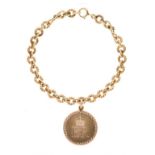 Cartier - 9ct gold medallion, with the Elizabeth II cypher, signed Cartier, on a 9ct gold