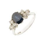 Sapphire and diamond seven stone 18ct white gold ring, the oval cut sapphire approximately 7.9mm x