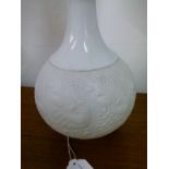 Pair of Rosenthal glazed and bisque porcelain relief moulded table lamps, having relief moulded