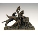 19th Century cast patinated bronze figure group of a huntsman with dead game, seated against a