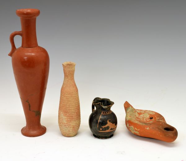 Antiquities - Four items of pottery comprising a glazed terracotta bottle vase of tapering slender