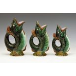 Graduated set of three late 19th Century majolica 'gurgle' or 'glug-glug' jugs in the form of