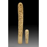 Two 19th Century Indian carved ivory handles, the longer possibly from a sword or staff, the shorter
