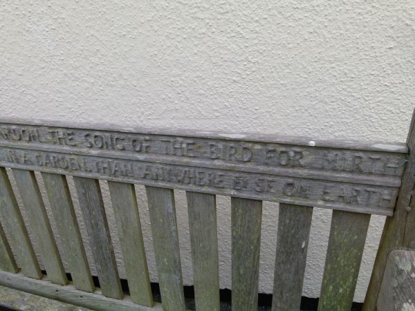 Mid 20th Century weathered teak garden bench, the back rail carved with verses from 'God's Garden' - Image 8 of 9