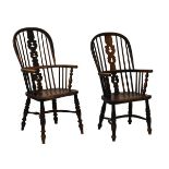 Two 19th Century ash, elm and fruitwood hoop back Windsor arm chairs, each with 'Christmas Tree'