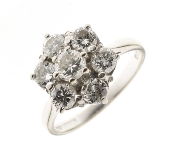 Seven stone diamond 18ct white gold cluster ring, the central brilliant cut of approximately 0.25