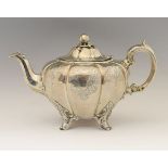 William IV silver teapot, of lobed form standing on four splayed decorative feet, sponsors mark