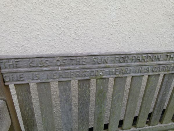 Mid 20th Century weathered teak garden bench, the back rail carved with verses from 'God's Garden' - Image 7 of 9