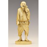 Japanese Meiji period carved ivory okimono, of a gentleman carrying a stick, with papers tucked in
