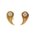 Pair of 18ct gold diamond ear studs, the single brilliant cut diamond to a leaf shaped mount, the