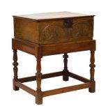 17th Century inlaid oak Bible box, the moulded plank lid over lunette-carved front between ebony and