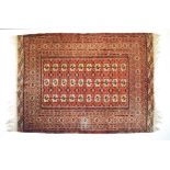 Mid 20th Century Middle Eastern (Tekke Turkoman or Belouch) rug, the brick-red field with three rows